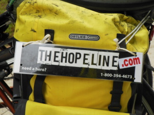 TheHopeLine sign on Tim's pannier